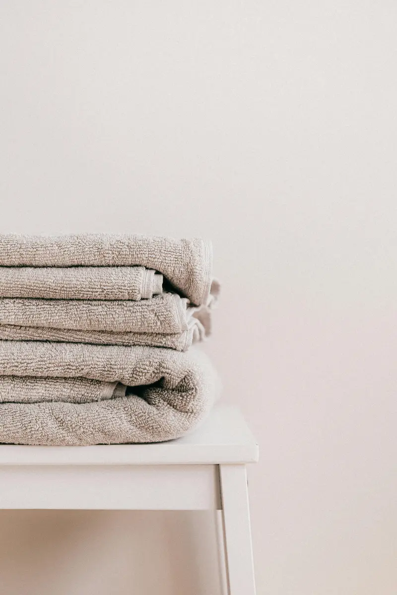 Soft, eco-friendly cloth towels neatly folded for a sustainable bathroom