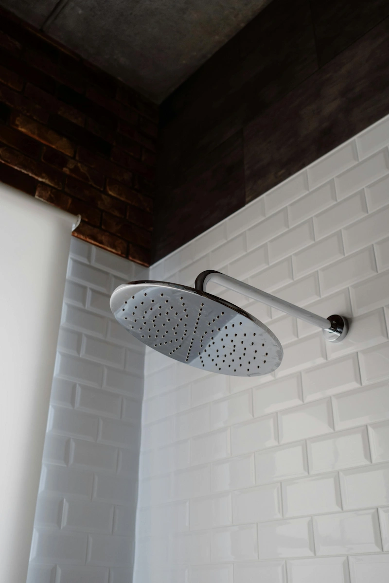 Installation of a low-flow showerhead to reduce water and energy usage